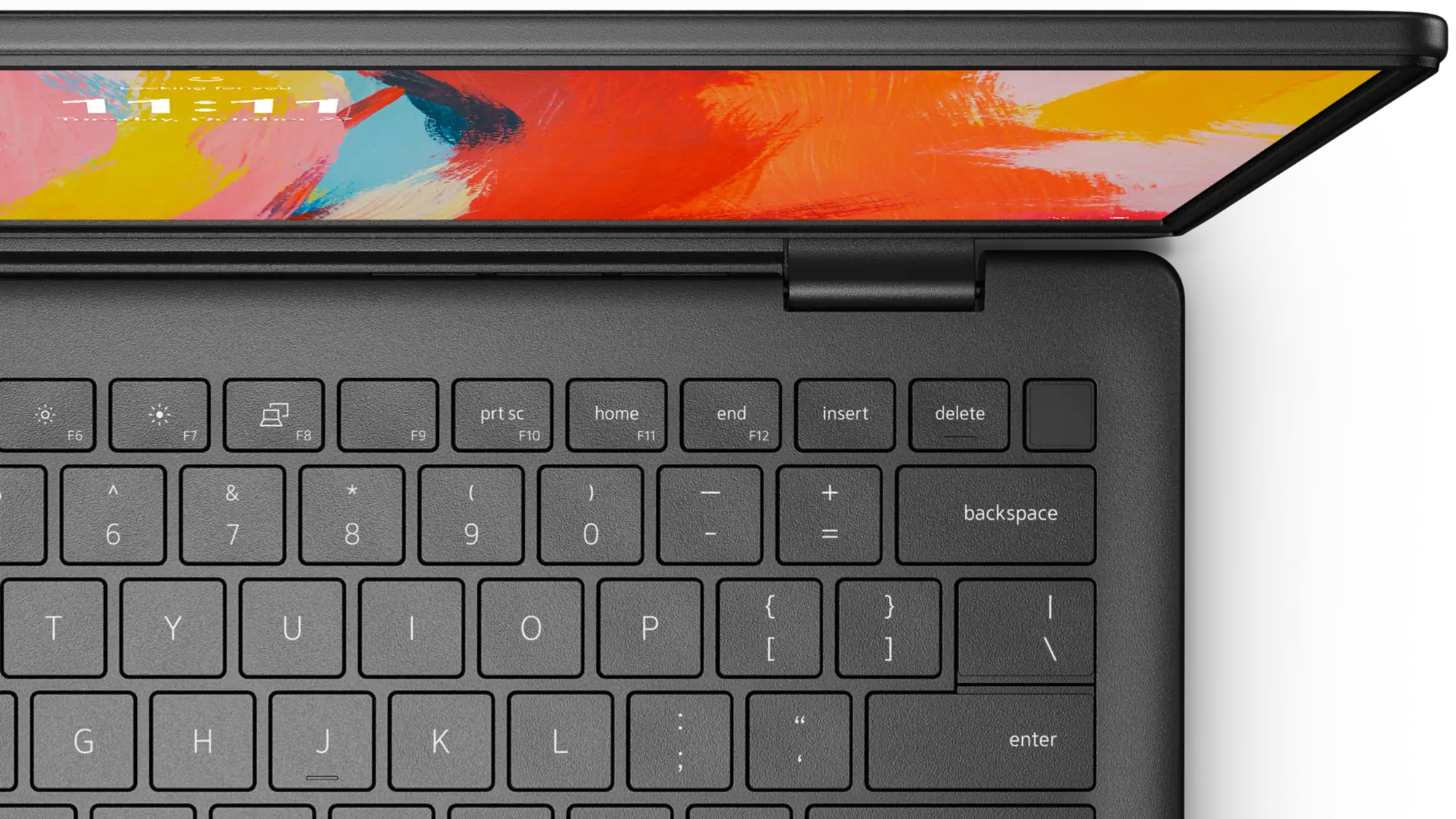 Ukazano laptop Dell z góry, przedstawiając fragment jego klawiatury